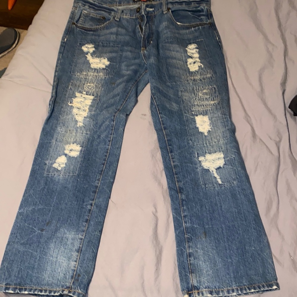 Distressed medium wash jeans